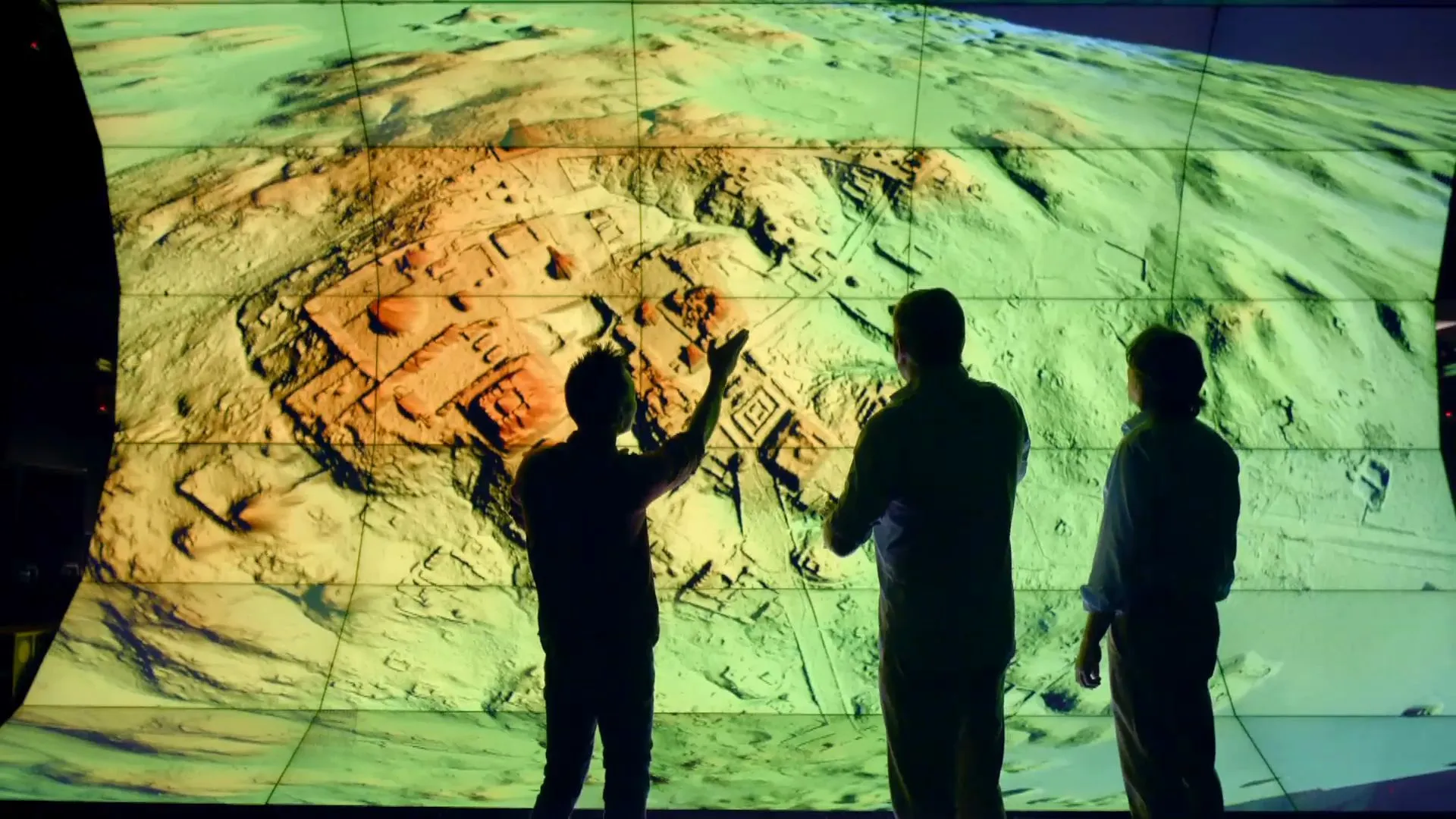 Archeologists and researchers at the Qualcomm Institute observing the LIDAR scan data for the first time